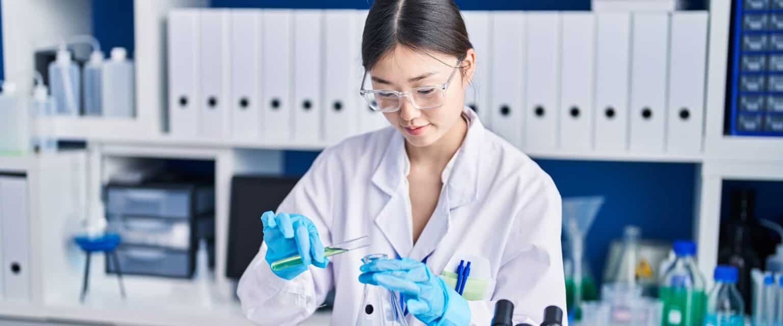 A medical researcher is measuring the contents of a vial.