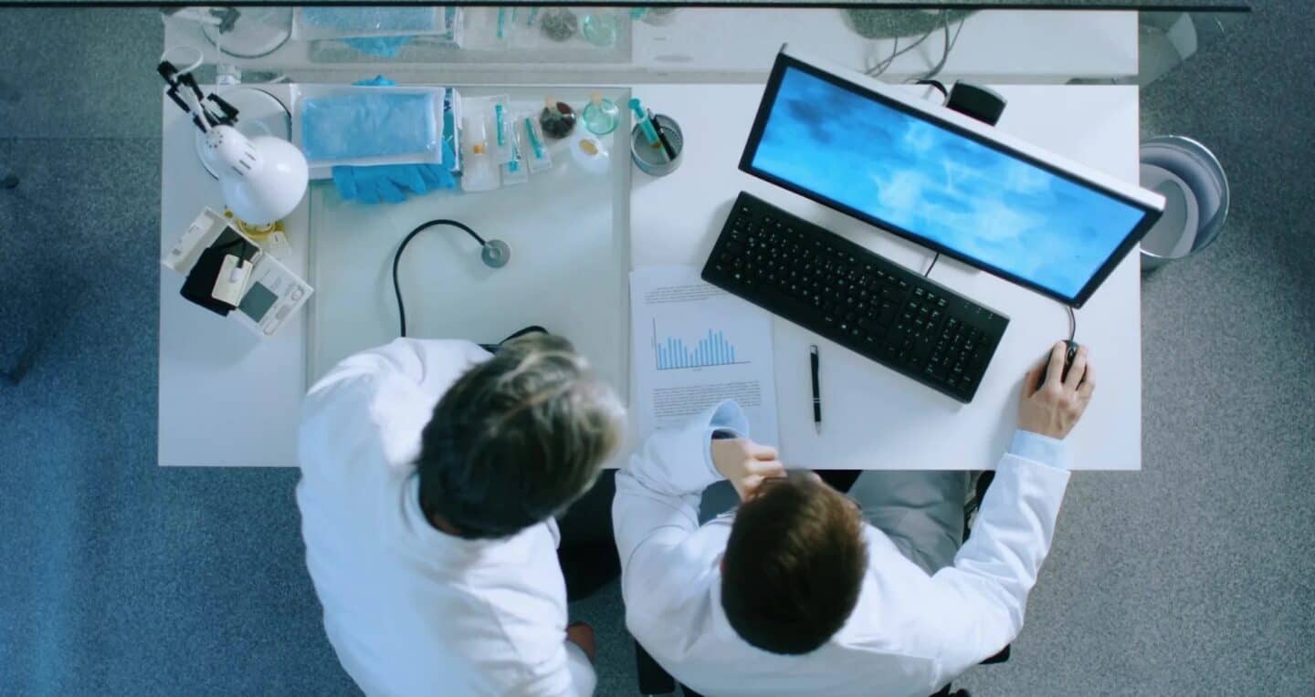 Medical researchers at a medical device company reviewing data